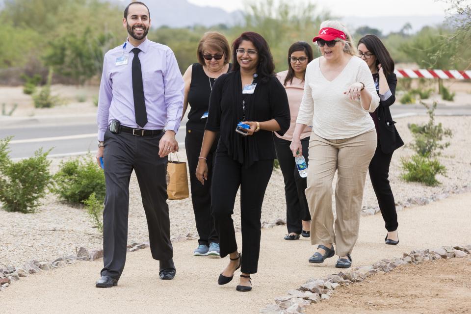 Mayo Clinic staff take a stroll on the nature trail, opened in November 2016 on the Phoenix campus. The trail continues for 3.6 miles around the campus and is open to all staff, patients and visitors, including guests of the Village at Mayo Clinic and Hospice of the Val