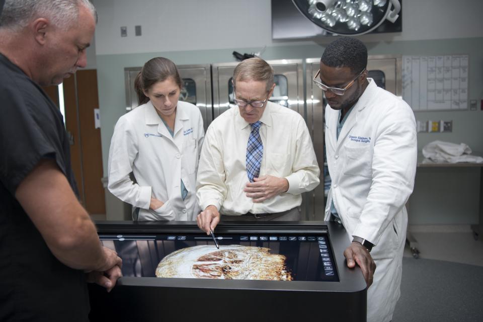 Innovation and collaboration come together as neurosurgeons at Mayo Clinic use a table-size touchscreen that shows human anatomy in 3D created from a patient’s MRI.