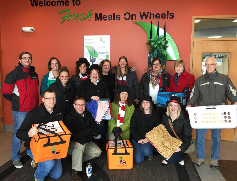 A group of Acuity employees volunteering for a local cause, Meals on Wheels.