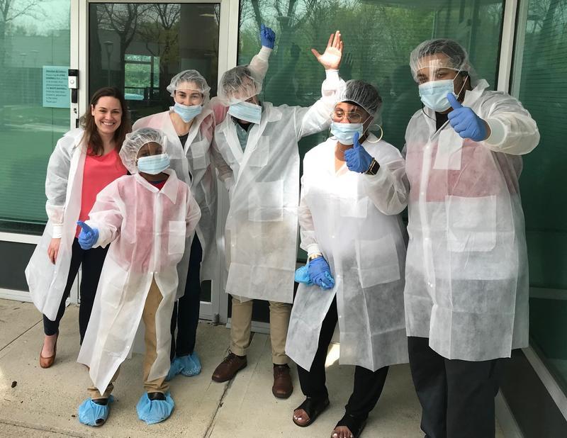 CooperSurgical Labtech employees working and wearing masks for COVID safety.