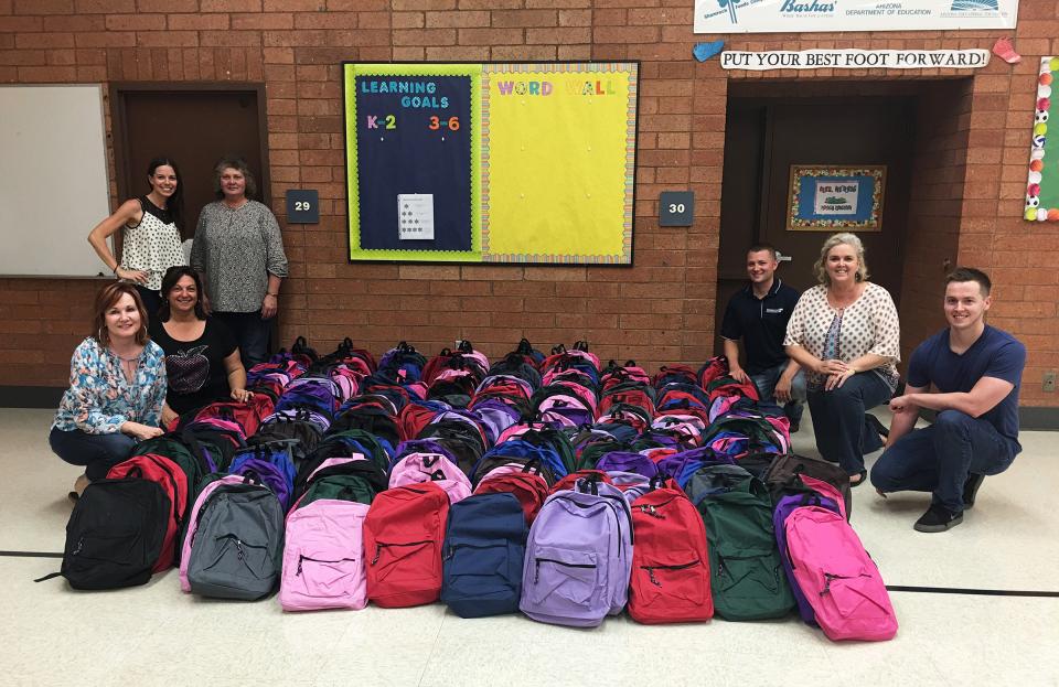 Chandler Branch donates backpacks to a local school for HFG’s 2016 Summer Charity Initiative