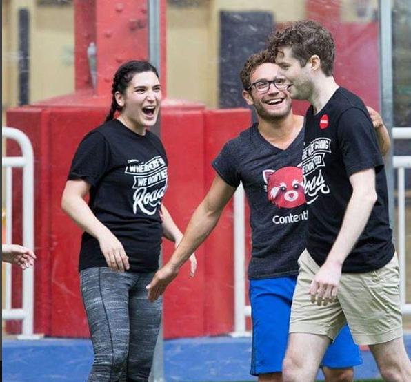 A senior product manager, the director of content strategy, and a senior software engineer celebrate a dodgeball comeback.