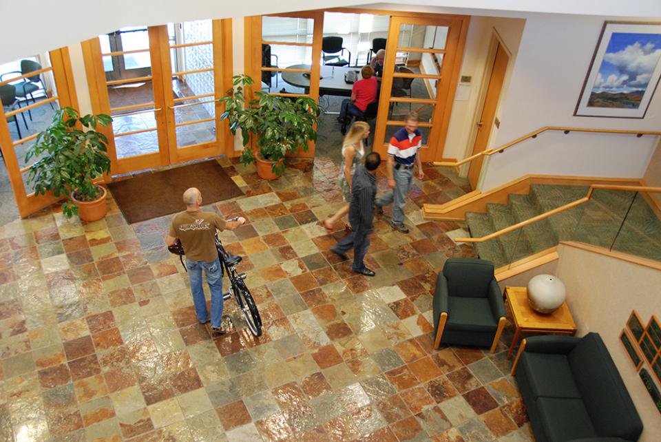 Employees pass through the large, open lobby of the main building on the Healthwise Boise campus.