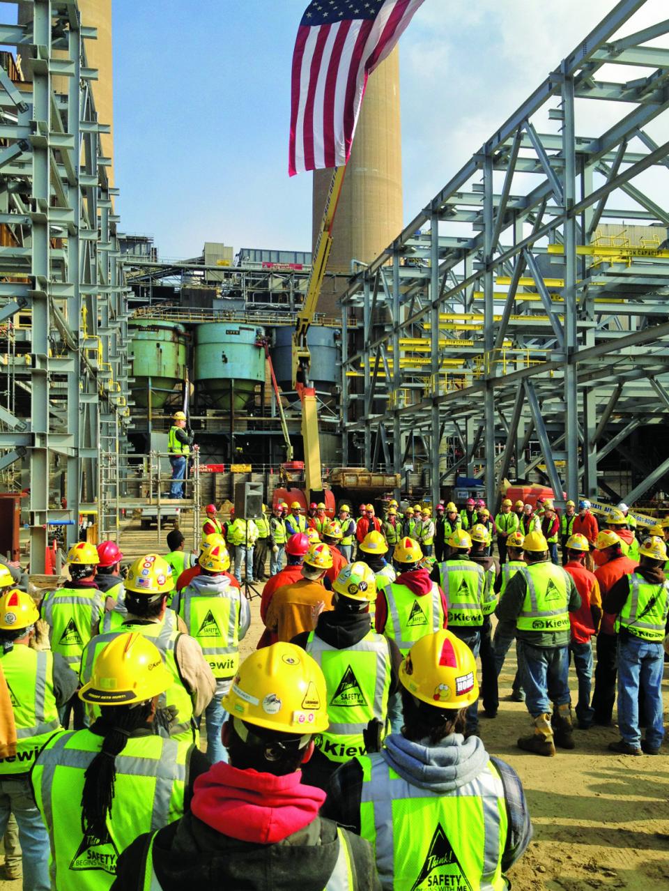 A Kiewit project team pauses in recognition of Veterans Day