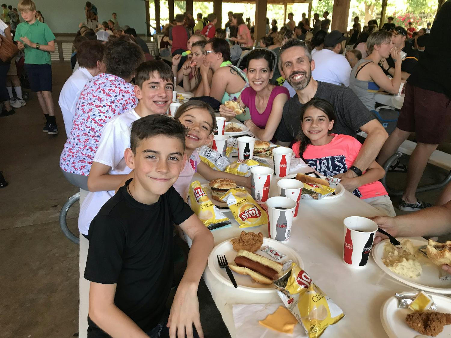 Employees and their families enjoy a drive-in movie night held in the parking lot of our global headquarters