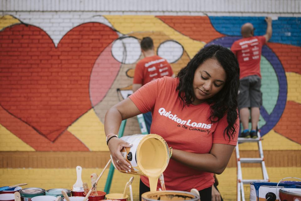 In the summer of 2019, team members volunteered to paint murals in partnership with the Small Business Mural Project.