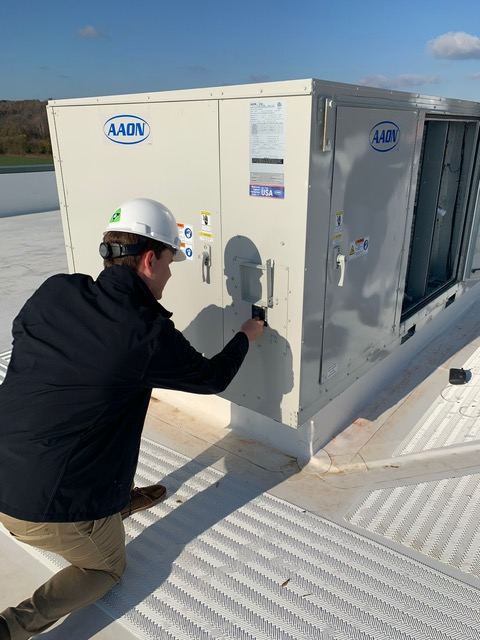 Melink Field Service Engineer performing a Test & Balance. 