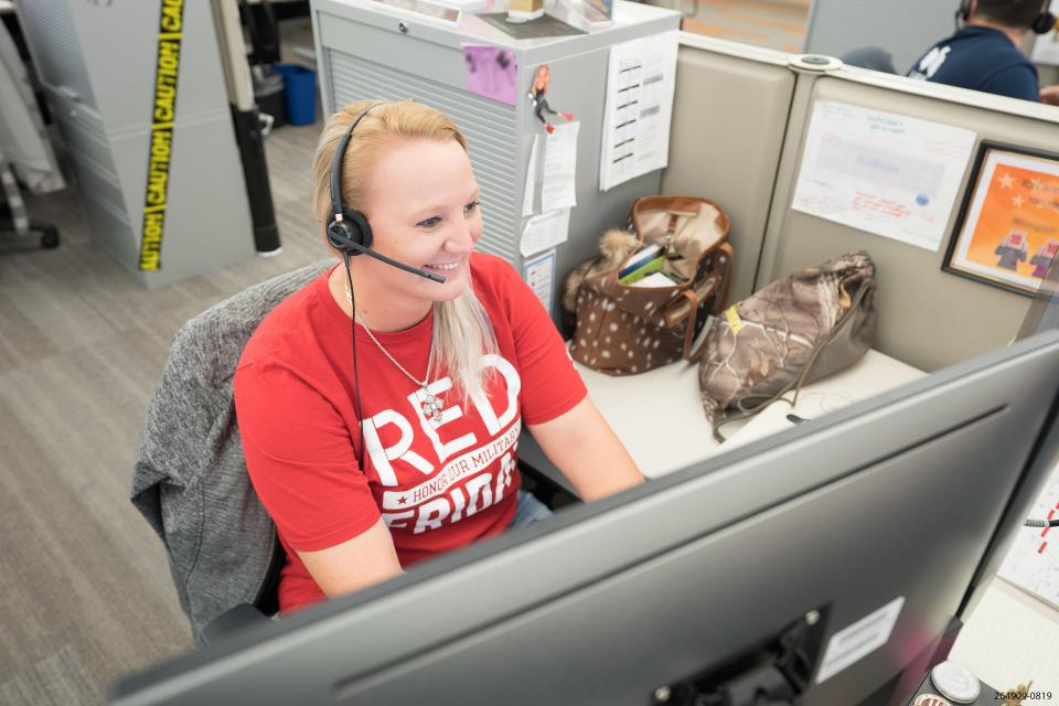 USAA employee and Army combat veteran Larkin O’Hern participates in a USAA volunteer effort.