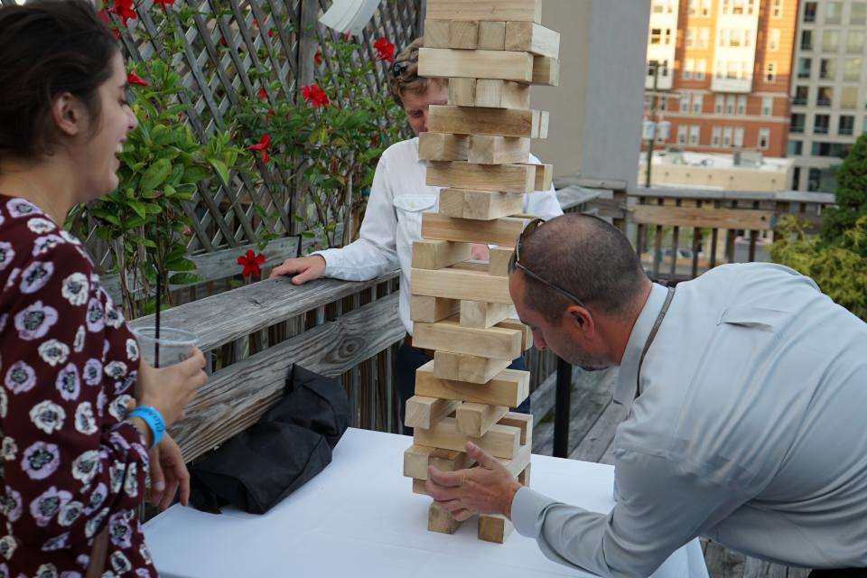 Our people enjoying Giant Jenga at a company event