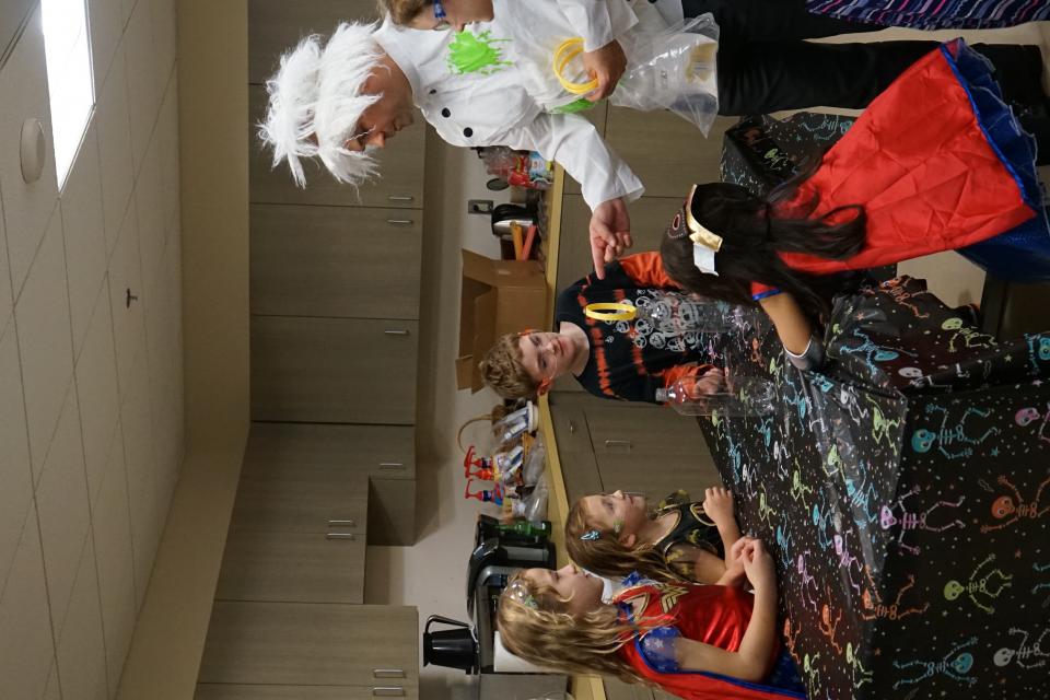 A few of the children of DL at Halloween learning from Mad Scientist Jeremy!