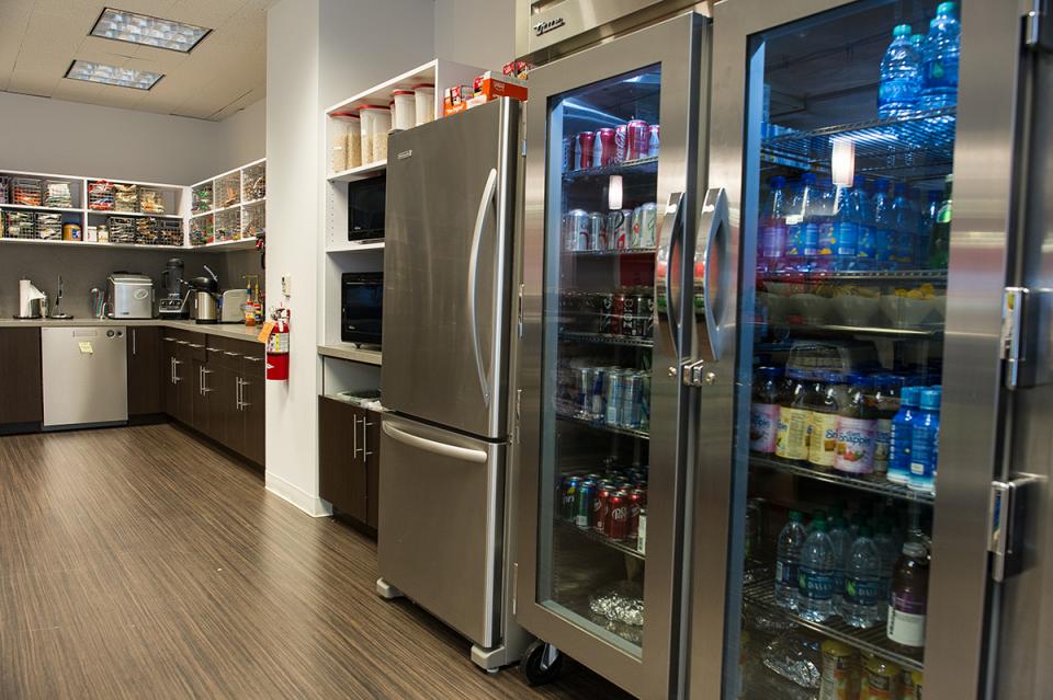 Well stocked on beverages in the kitchen.