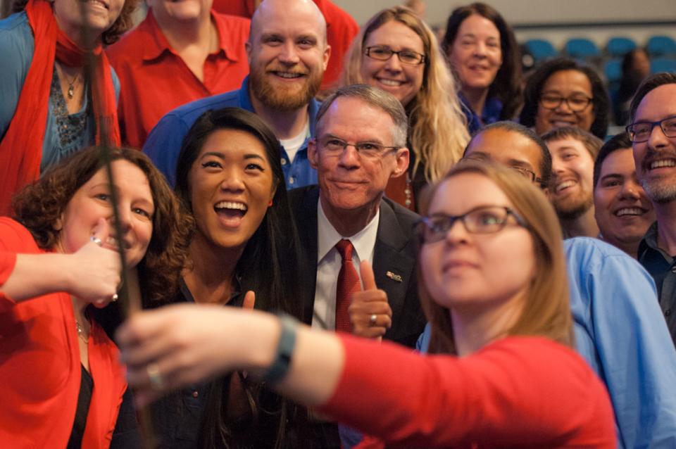 Richard Davis, Chairman and CEO, taking a selfie with employees at the 2016 All Employee Event
