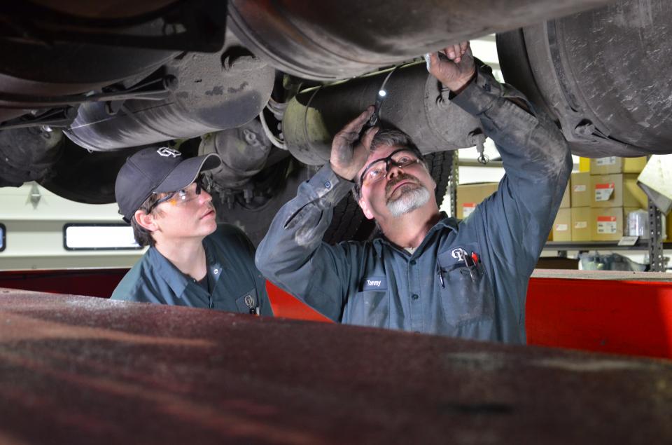 Technicians performing routine maintenance