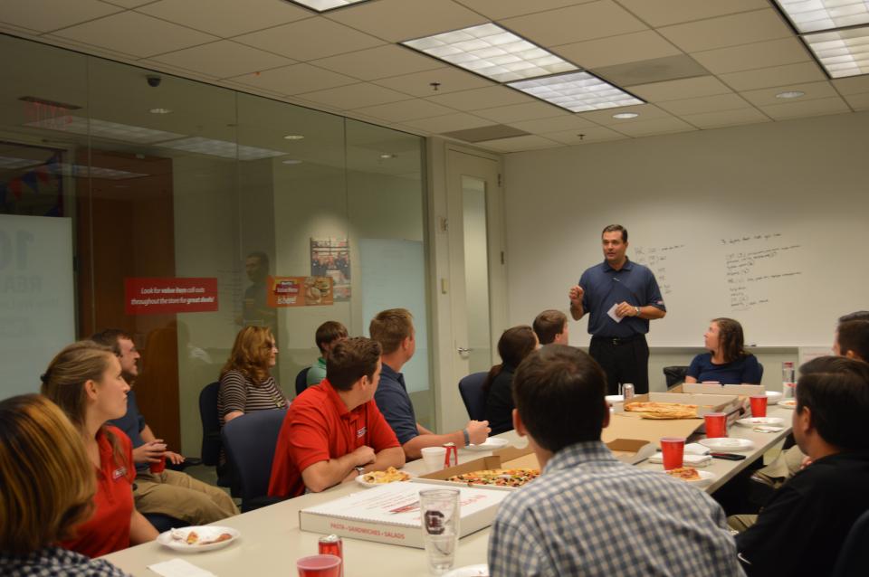 Billy Milam, President, speaks at a lunch meeting.