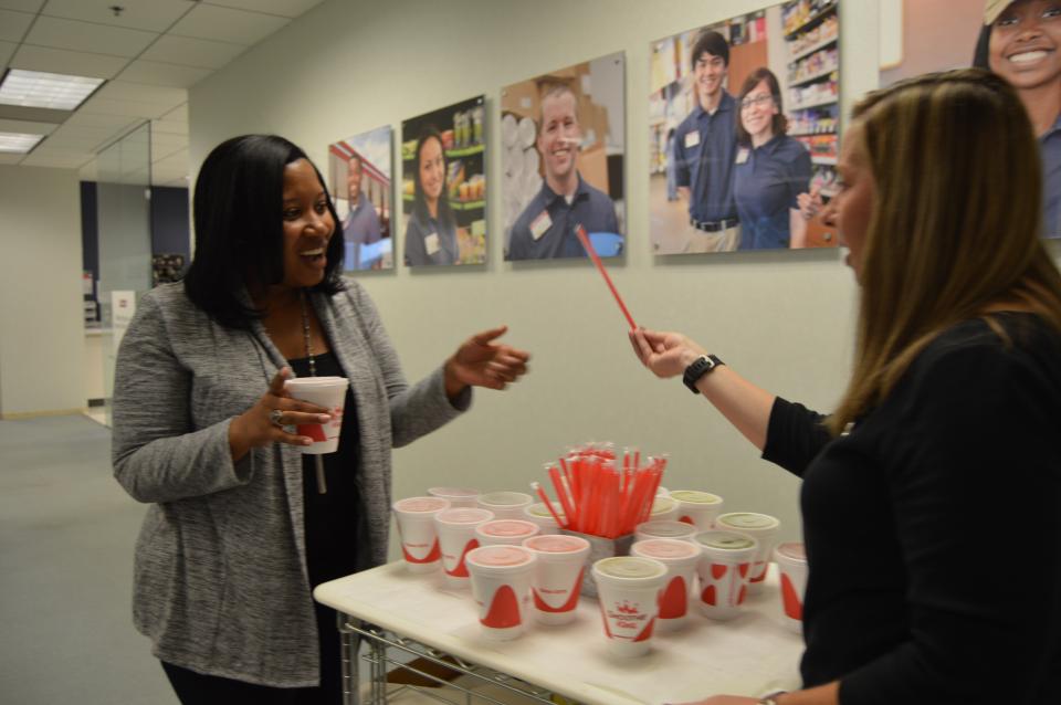 VP of Total Rewards, Whitney Woodward, hands out a special treat to SSC Team Members.