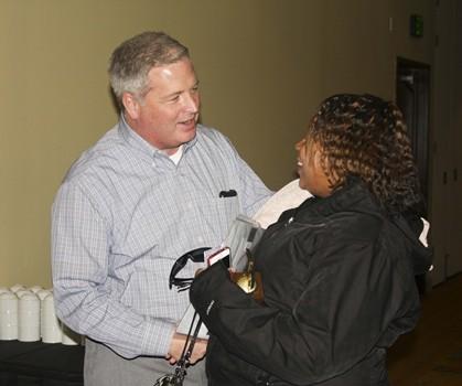 CEO greeting employees at Awards Night