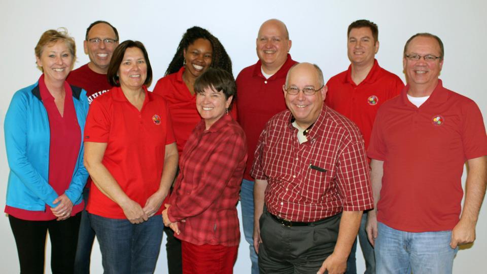 Employees presenting one of ten $10,000 awards in the annual Nation of Neighbors Program.