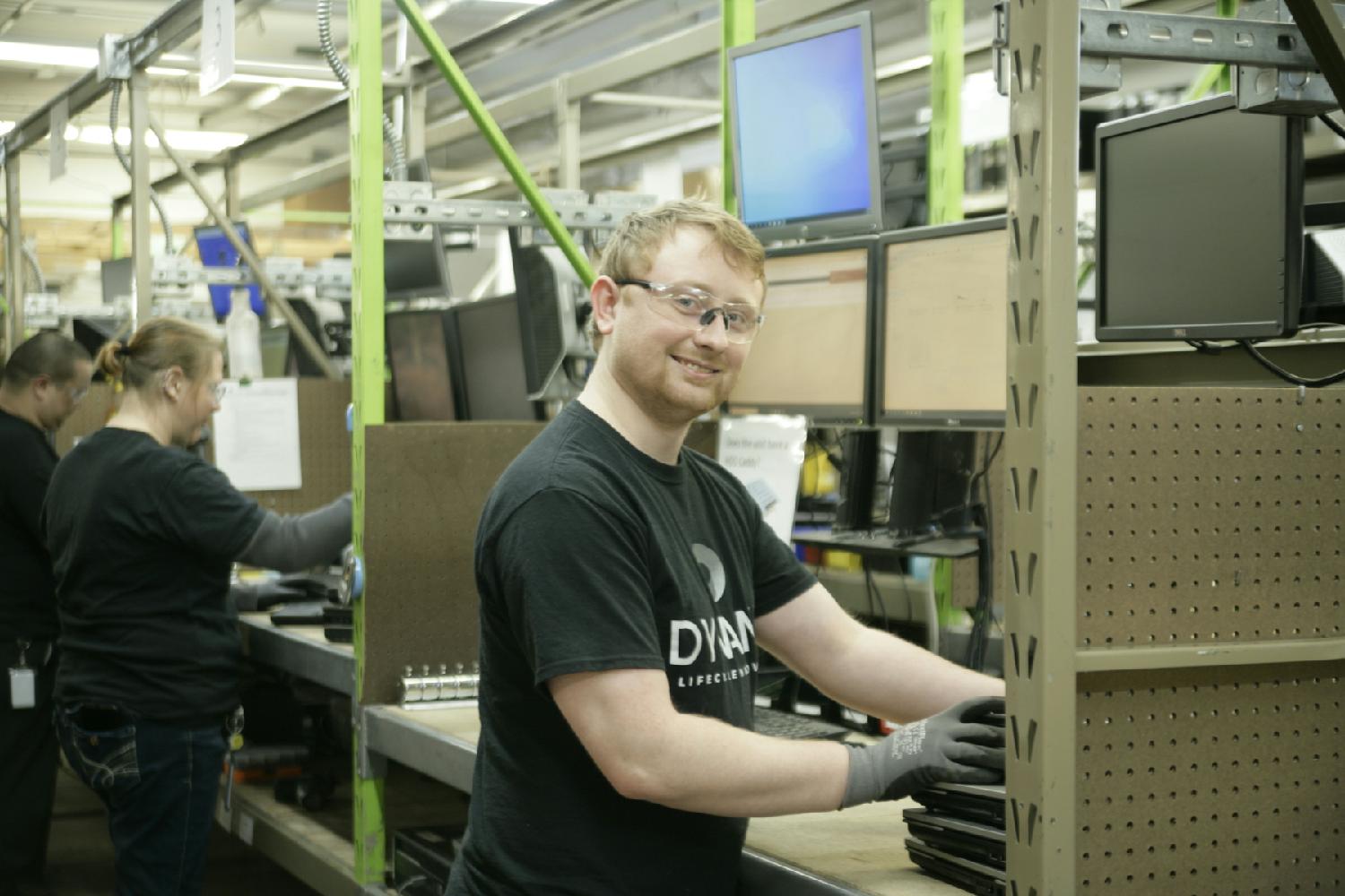 Cesar and Charlie sharing a laugh in the Onalaska, WI facility.