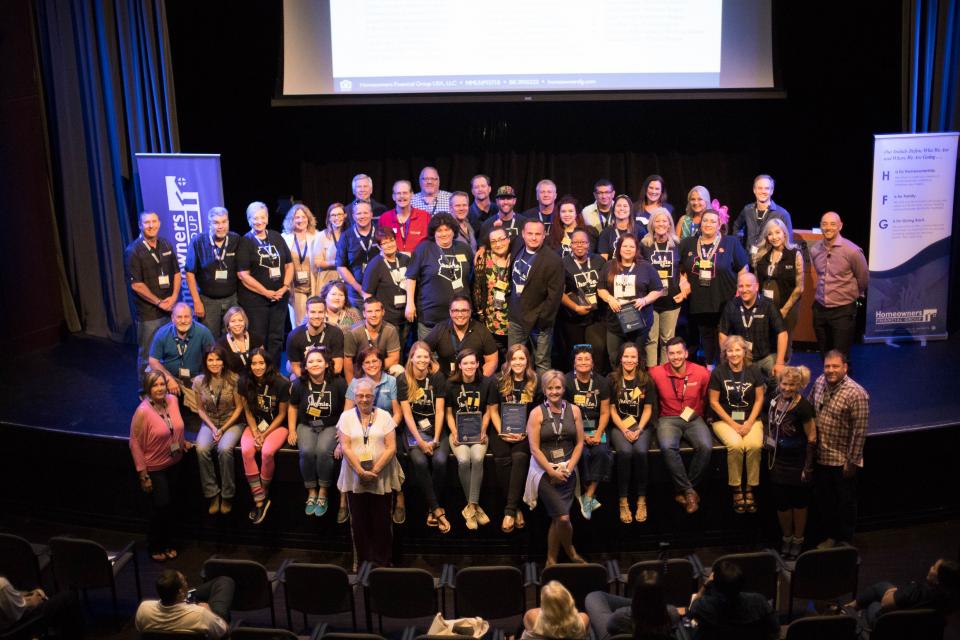 The Culture Committee is recognized on stage at the company-wide State of the Union event. All members received a “thumbs up” plaque, and the leads were presented with a custom framed award.