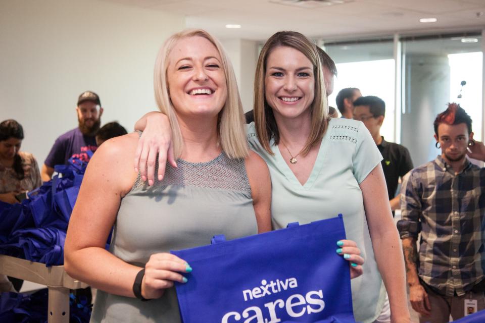 Nextiva Cares volunteers packing toiletry bags for a local nonprofit