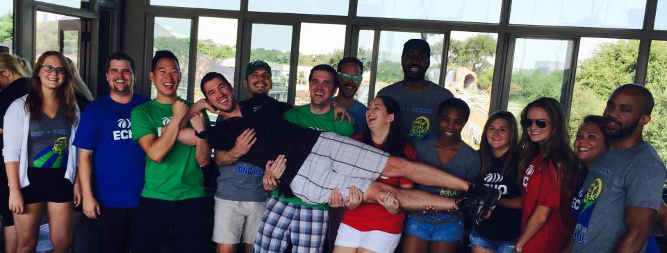 We Carry the Load Together, literally! Echo Dallas trainees hold up their trainer, Luke, at a company outing.