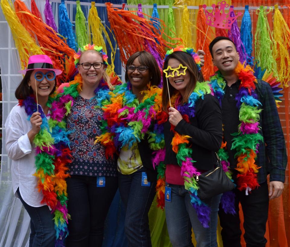 Employees have fun at the photo booth during Employee Appreciation 