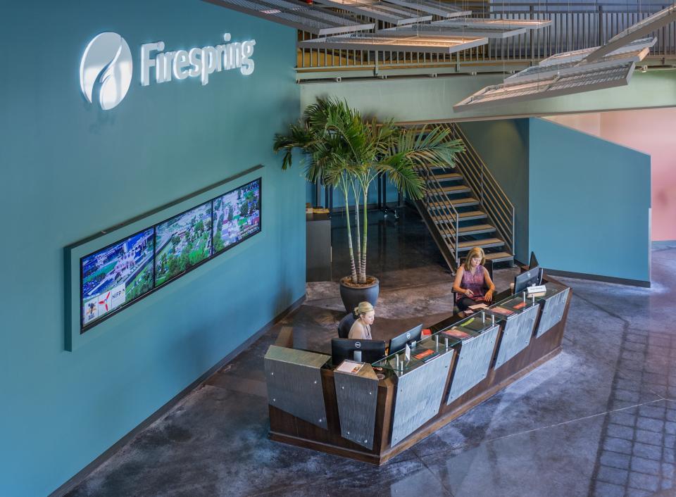 Visitors are greeted with a friendly smile and a glimpse of Firespring's video and interative portfolio.