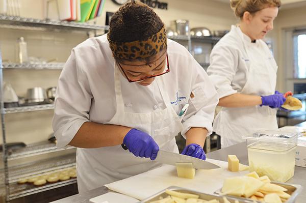 Culinary students practice live work