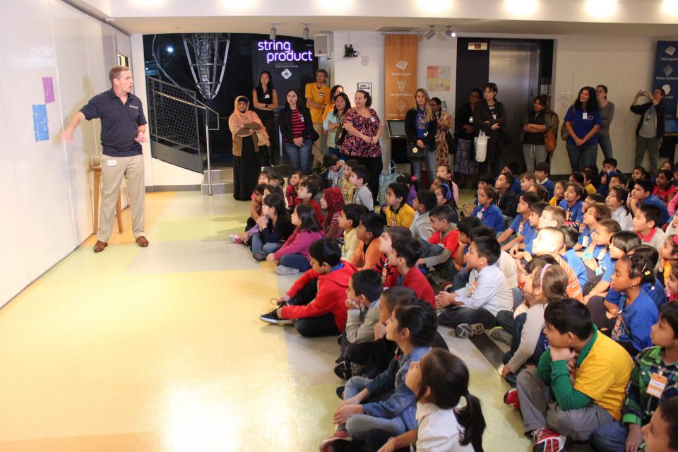 OppenheimerFunds Chairman and CEO, Art Steinmetz, gives a math class to first and second graders visiting the National Museum of Math.