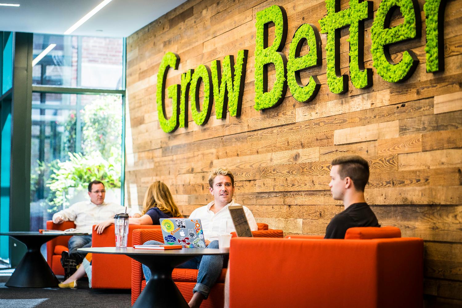 A HubSpot employee working remotely with a playful co-worker.