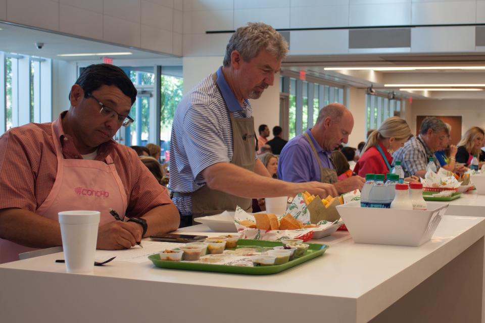 Employees judging salsa entries for annual salsa contest in our Artesia office