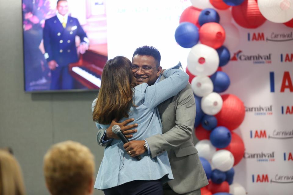 President Christine Duffy hugs I AM Leader winner after his heartfelt speech.