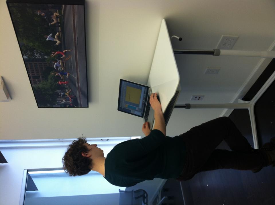 Graphic Designer working at a standing desk