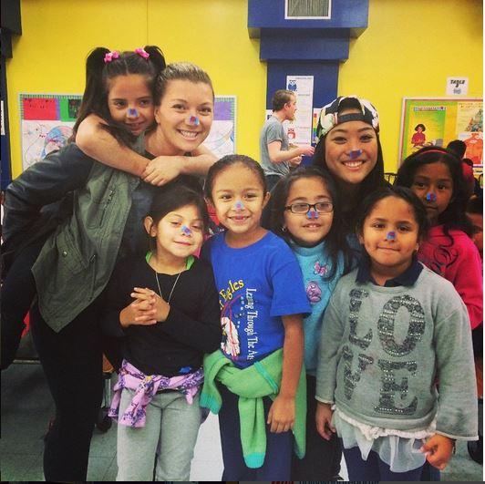 Employees hanging with campers during our annual Camp Summer Eagle in Compton.