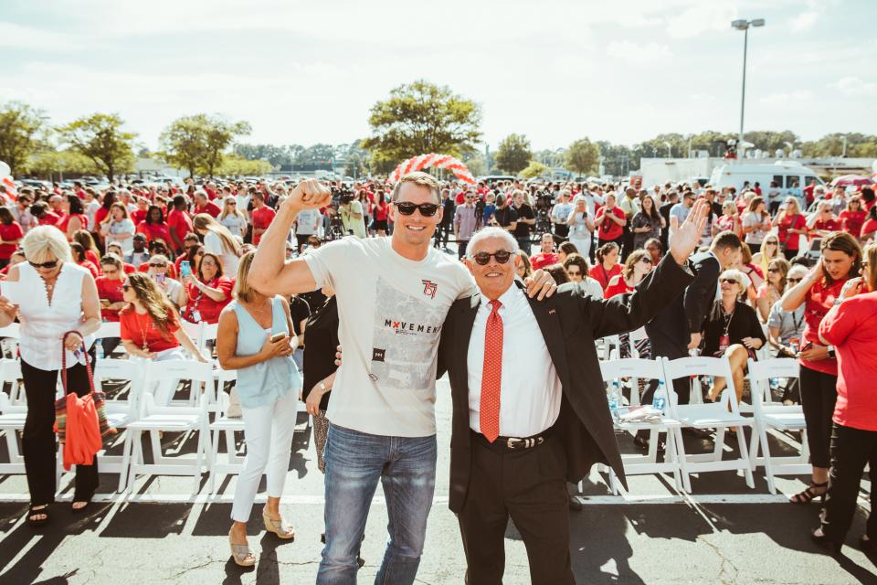 Co-founders Casey Crawford and Toby Harris celebrate the grand opening of the Movement Mortgage Norfolk operations center.