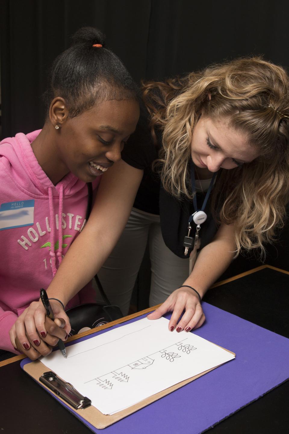 Employee Ashleigh Quinn with high school student during Disability Mentoring Day - October 2016.