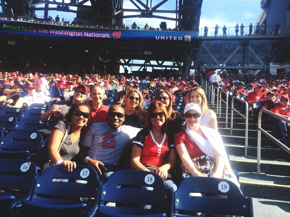 The Censeo operations team takes a break to cheer on the Nationals from Censeo's company seats