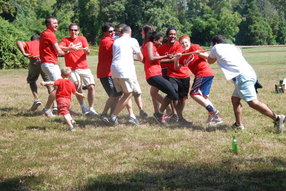 Censeo employees and their families enjoying tug-of-war at our annual Field Day event.