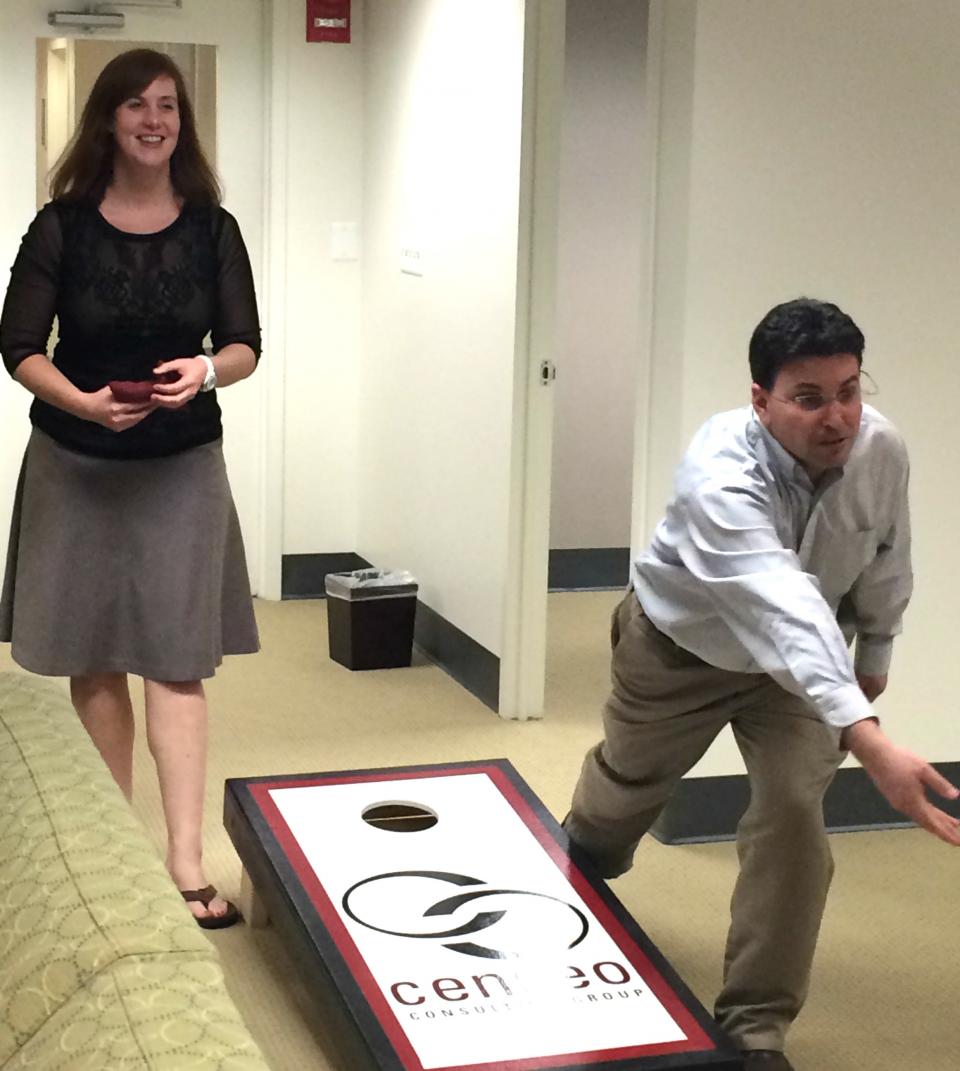 Employees face off in the cornhole round of Censeo's Winter Olympics