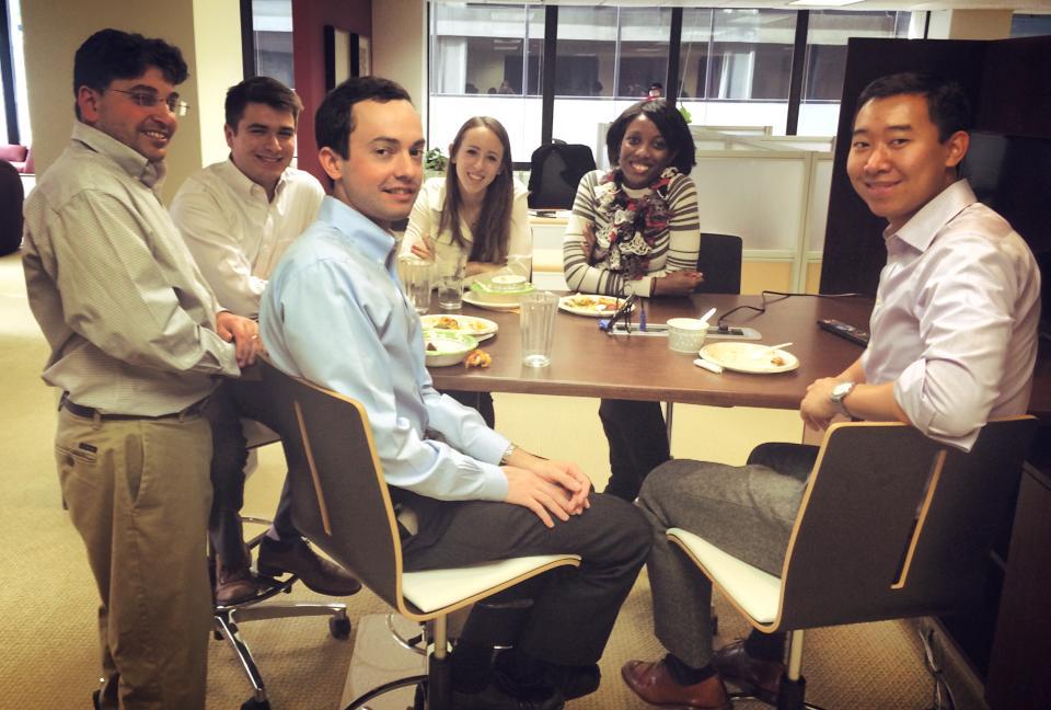 Employees enjoying a homemade feast at the annual Thanksgiving Potluck