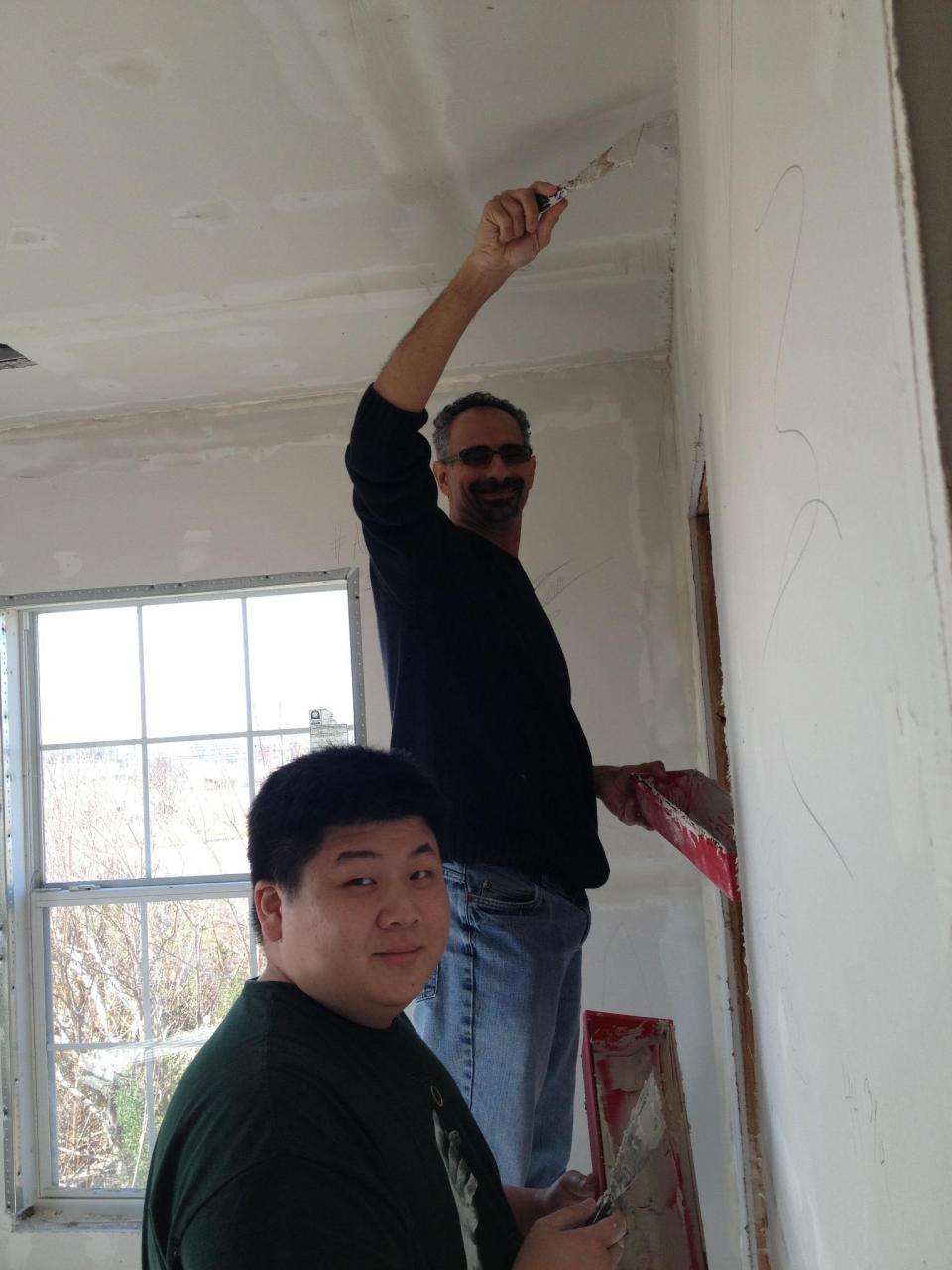 Hani Atalla and Kevin Chu, Function1 consultants, in action during our Habitat for Humanity event in 2013.