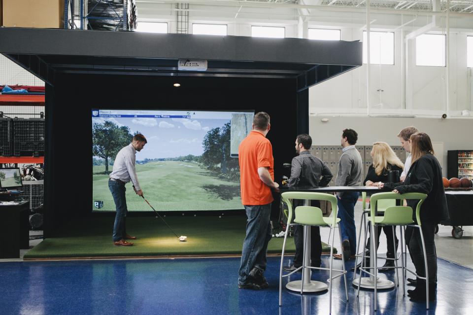 TRG Employees Enjoy the Golf Simulator