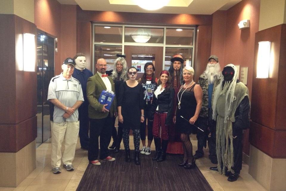 Halloween costume contest finalists at Approved Mortgage Corporation.