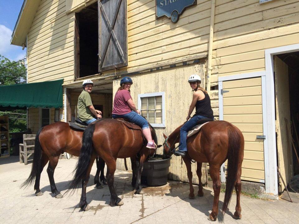 Northstar employees get ready for a horseback riding tour during the 2015 Company Account Management and Finance Retreat at Mohonk Mountain House Resort and Spa