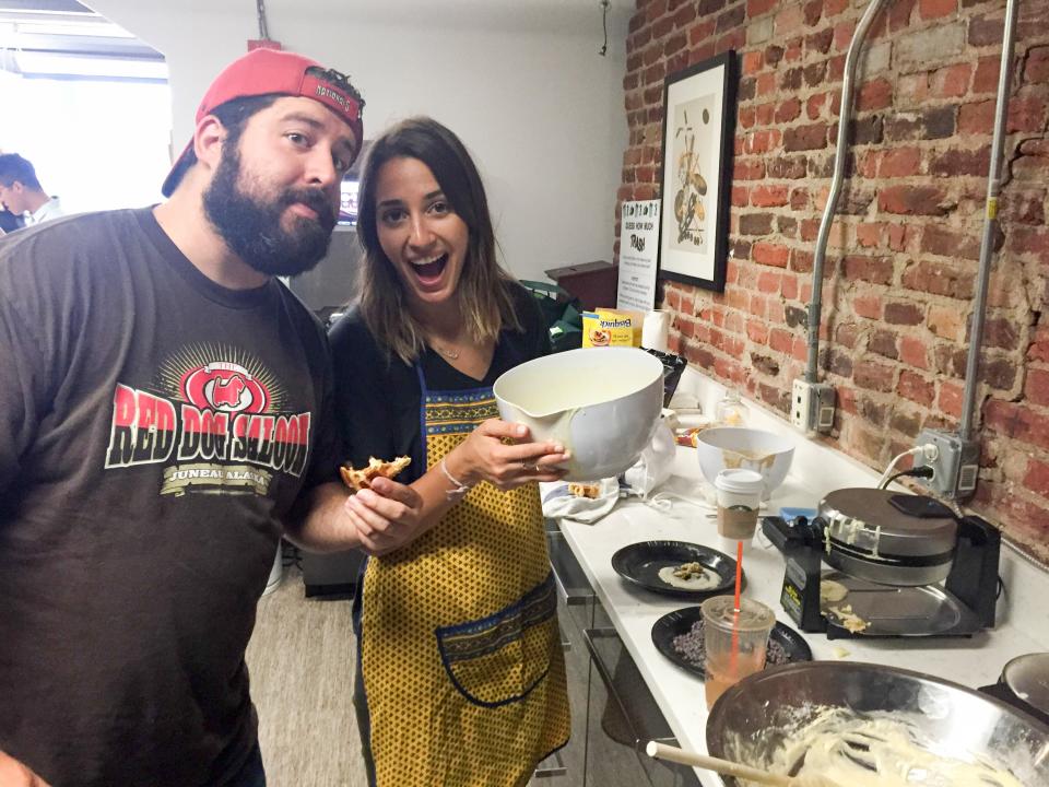 Cooking waffles together to welcome our new hires on their first morning