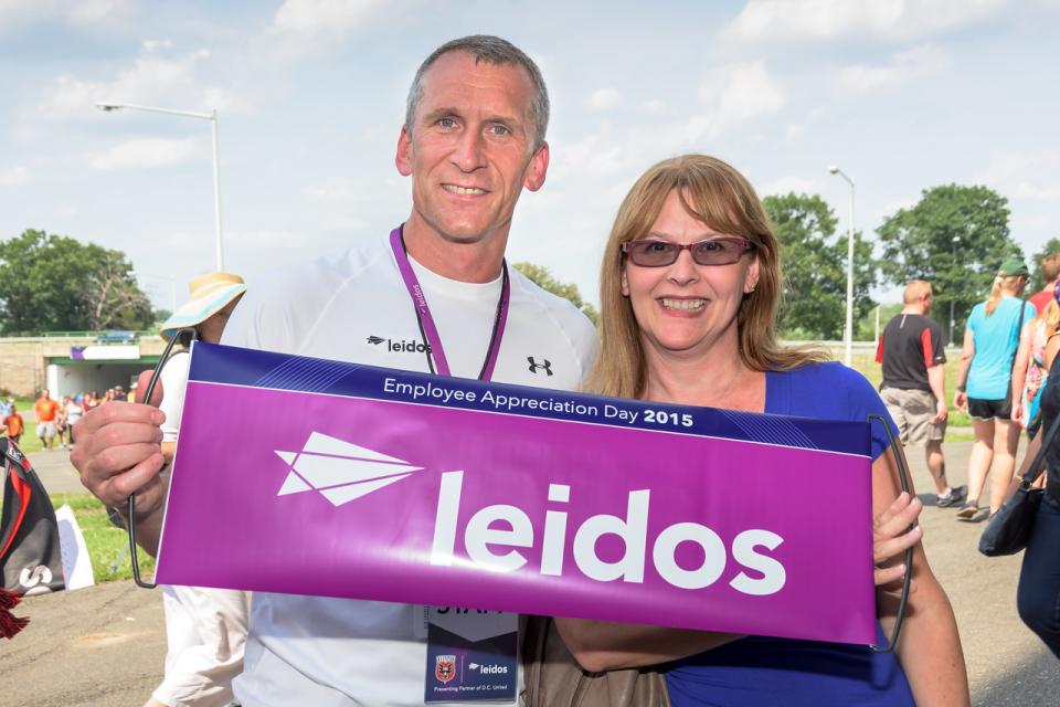 Leidos employee and his wife attending a DC United game for employee appreciation day on July 26, 2015 at RFK Stadium in Washington DC.