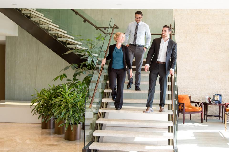 New York Office lawyers and staff gather on the offices steps.