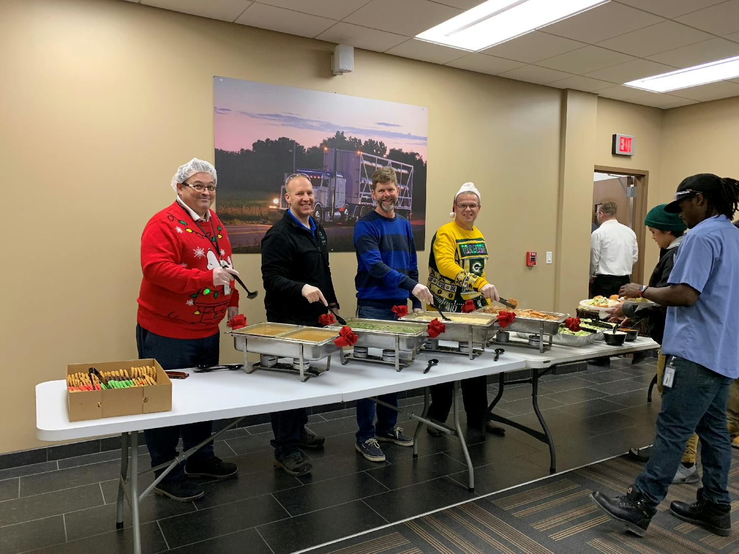 Our management team serving a holiday lunch to our people. 