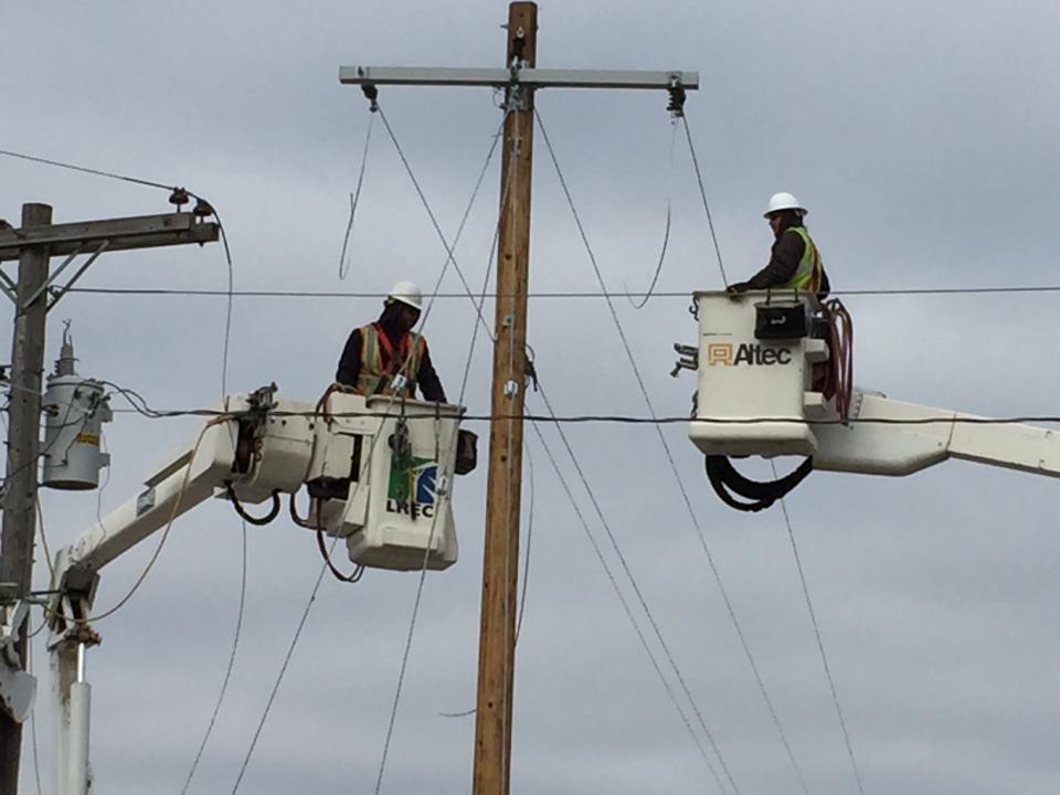 Lineworkers in action