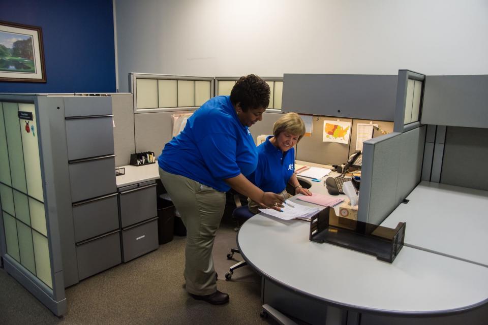 Account Managers working together to provide status reports to customers on their repairs.